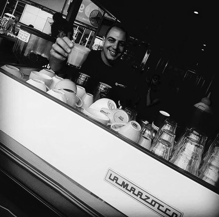 Paul behind the coffee machine on the restaurant floor